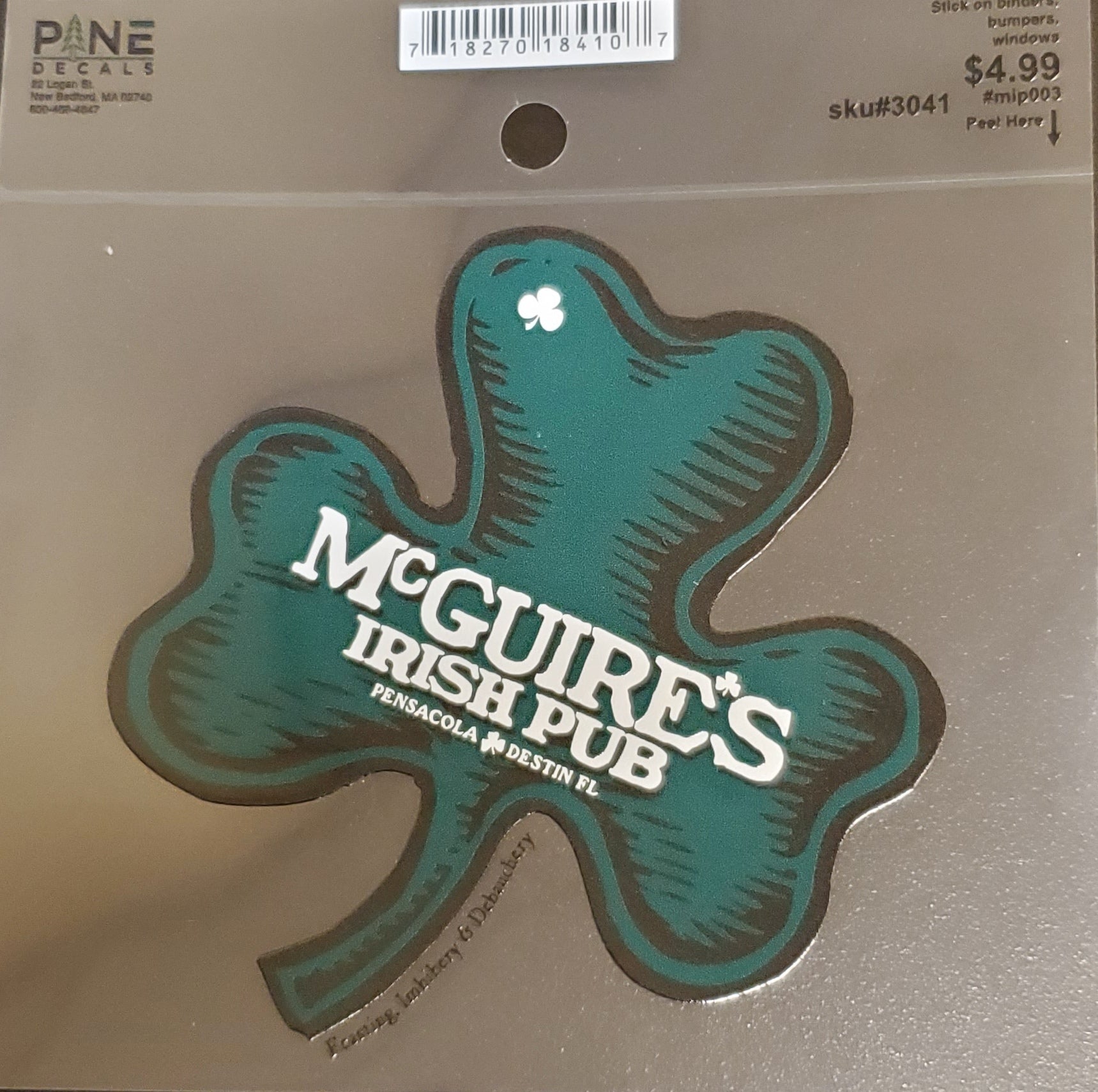 Shamrock-shaped decal for McGuire's Irish Pub on a clear background